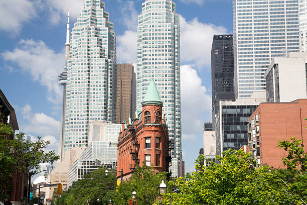Canada - Toronto - Downtown Downtown Toronto with Skyscrapers, Sunshine and Clouds. flatiron building toronto stock pictures, royalty-free photos & images