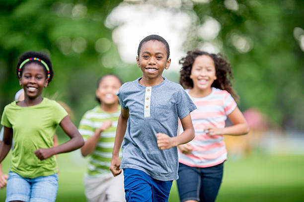 istock Kids Runnign Around at the Park 487684864
