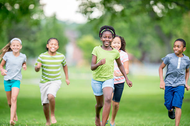 istock Children Playing Tag at the Park 487684988