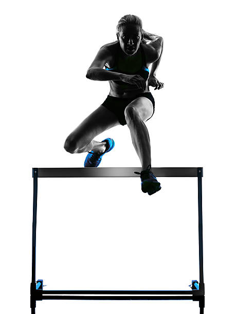 istock woman hurdlers  hurdling  silhouette 487685578