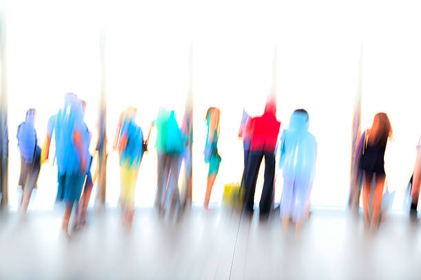 istock Large Group of Blurred, Unrecognizable People 487685776