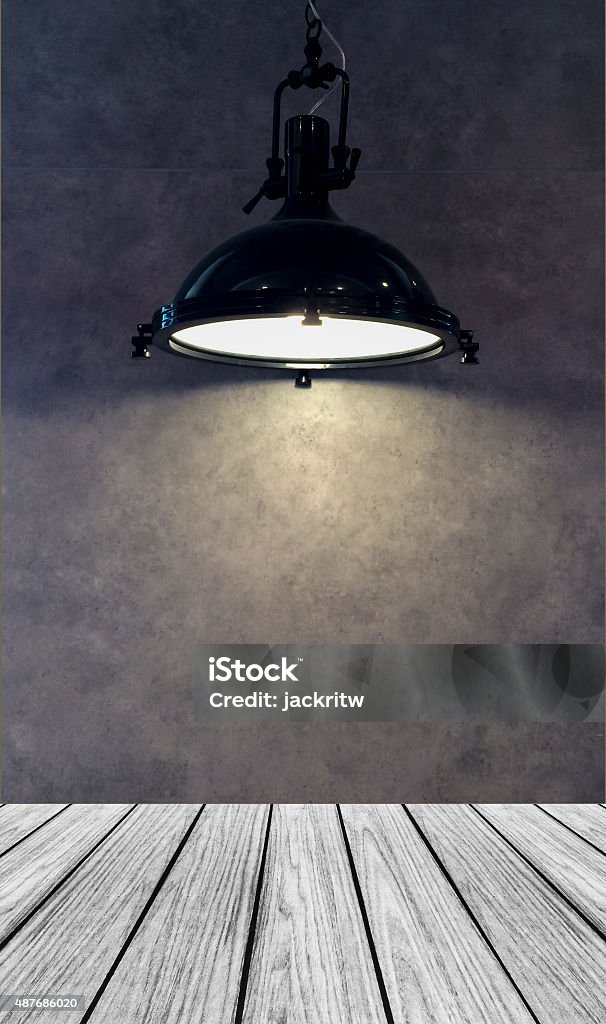 Empty Wooden Perspective Platform with Lamp Shade Empty Wooden Perspective Platform with Lamp Shade from Modern Black Metal Lamp Hanging on Gray Wall Background with Copyspace used as Template to Mock up for Display Product Domestic Room Stock Photo