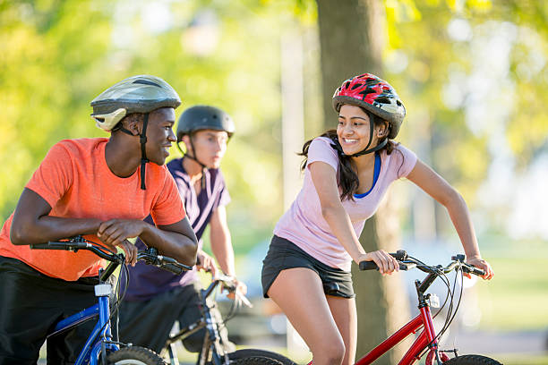 istock Friends Riding Through the Park Together 487686428