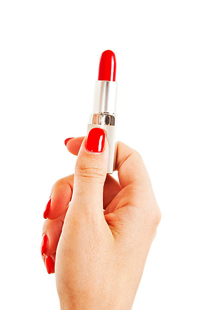 donna mano holding rossetto rosso - fingernail nail polish women human hand foto e immagini stock