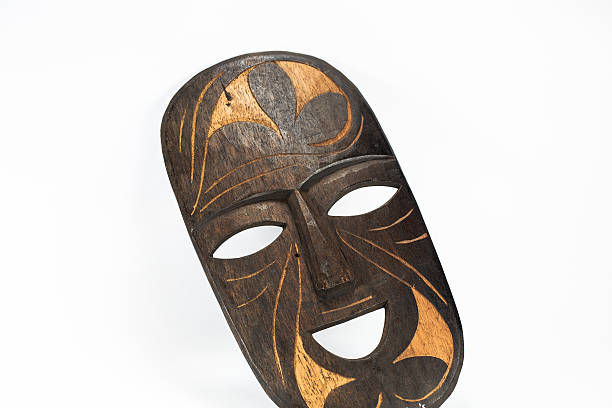 istock wooden mask, carve  on white background 487689725
