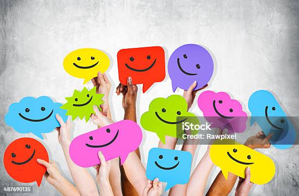 Hands Holding Smiley Faces Icons Stock Photo - Download Image Now - Anthropomorphic Smiley Face, Avatar, Communication