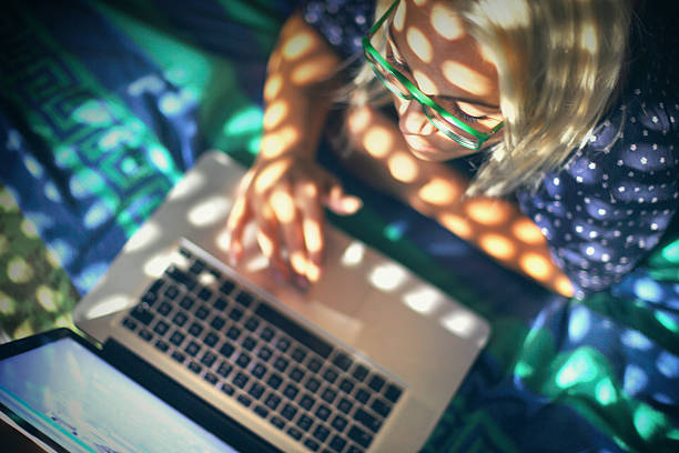 istock Woman using laptop at home. 487690762