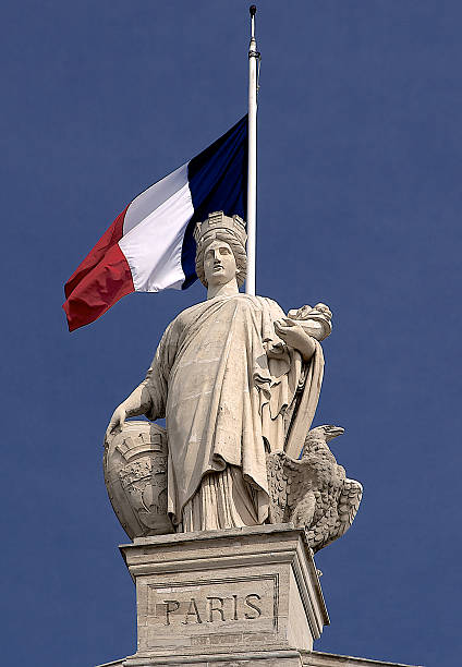 istock Paris statue with flag on Gare du Nord railway station 487691225