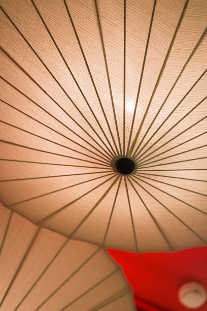 istock Gold and red japanese umbrella lamp for background 487691881