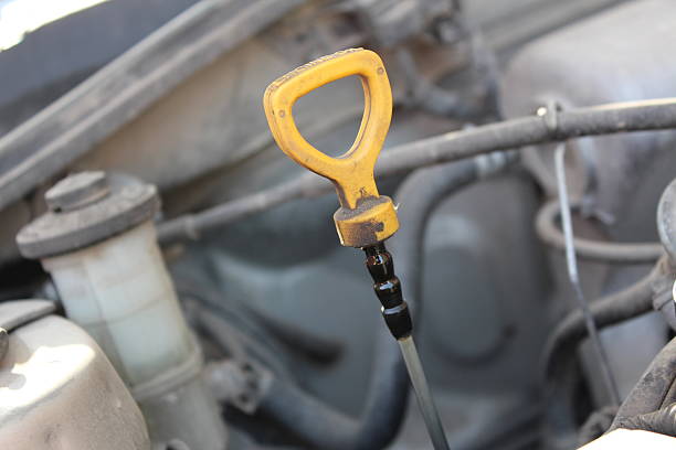 istock The oil dipstick of a car engine 487695062