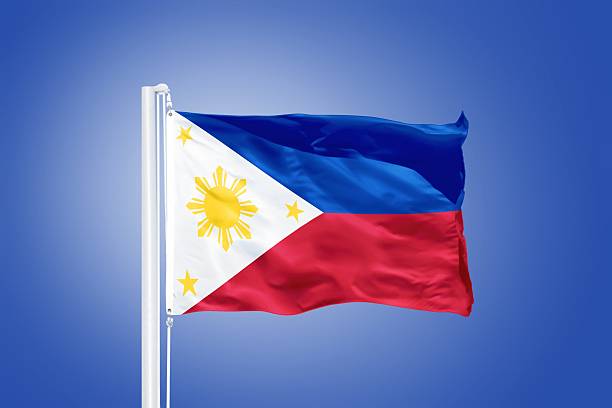 istock Flag of Philippines flying against a blue sky 487695596