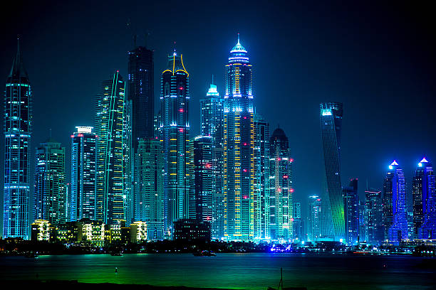 Dubai downtown night scene with city lights, luxury new high tech town in middle East, United Arab Emirates architecture. Dubai Marina cityscape, UAE