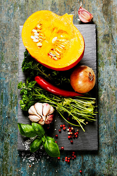 istock Pumpkin soup ingredients on wooden background 487696622