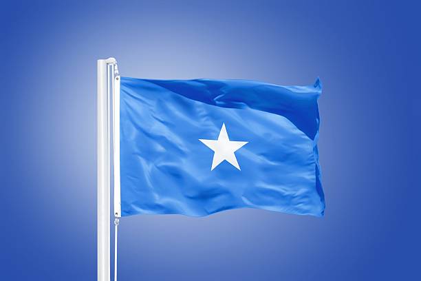 istock Flag of Somalia flying against a blue sky 487697624