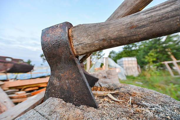 istock Old Lumberjack's axe stuck in a chopping block 487697932