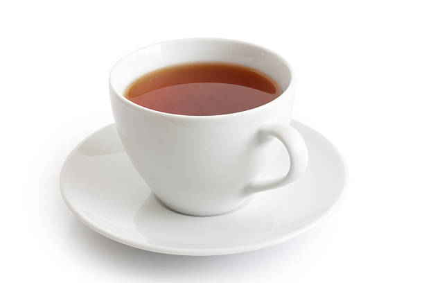 istock White ceramic cup and saucer with rooibos tea. 487702102