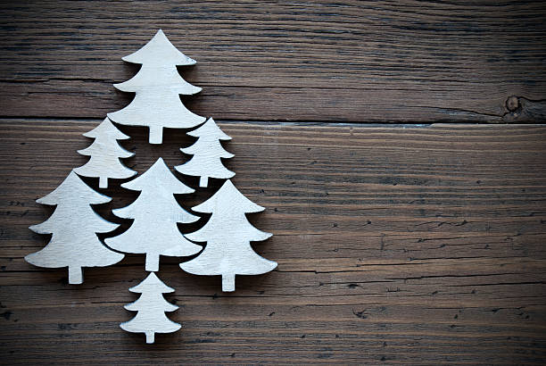 istock Christmas Trees On Brown Wooden Background Frame 487702518