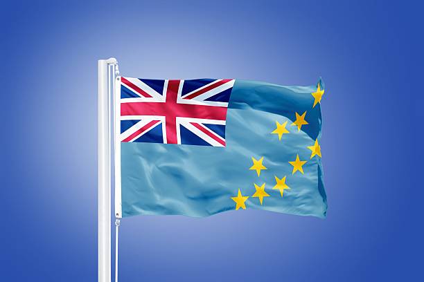 istock Flag of Tuvalu flying against a blue sky 487702652