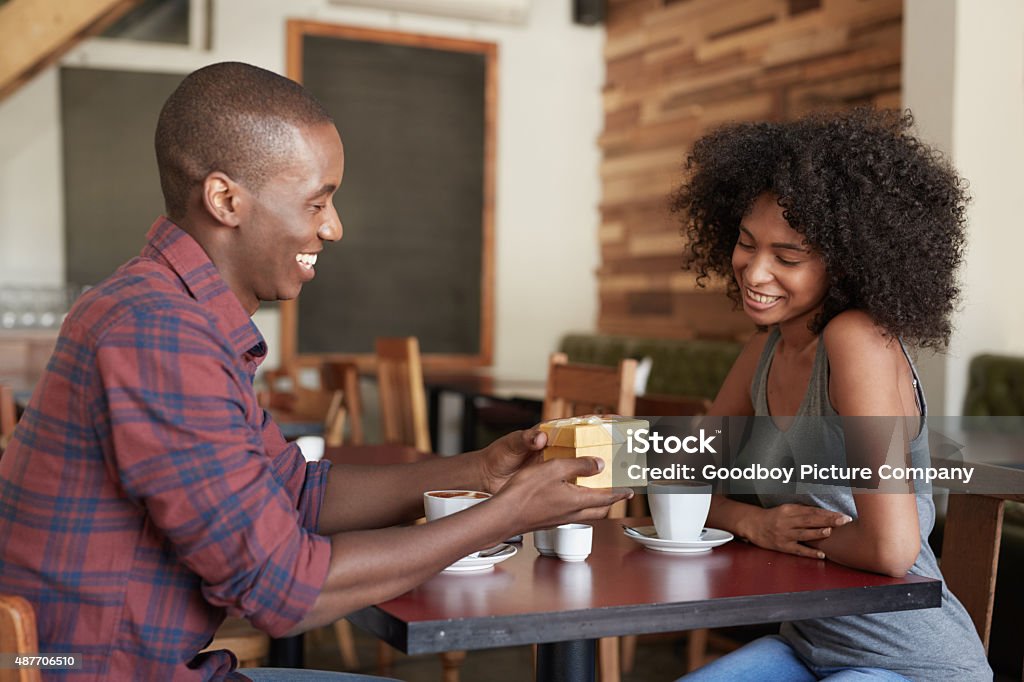 Just for you, baby Shot of a young man giving his girlfriend a gift while sitting in a cafehttp://195.154.178.81/DATA/i_collage/pu/shoots/804975.jpg 20-29 Years Stock Photo