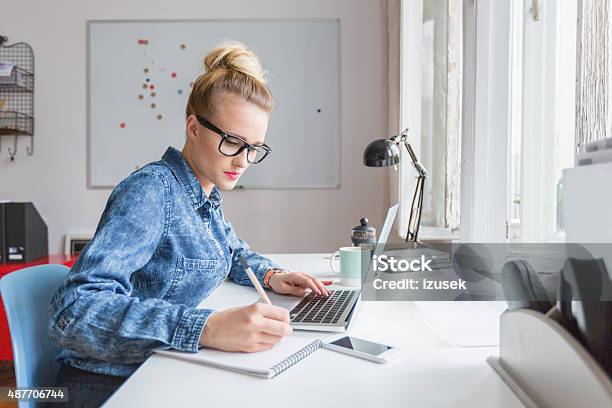 Woman Working On Computer In An Office Stock Photo - Download Image Now - Marketing, Writing - Activity, E-Mail