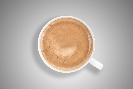 Delicious cup of coffee from directly above. Soft shadows, gradient background. Very unique digitally created composition.
