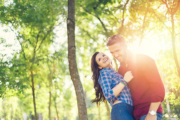 istock Young couple in the park 487712808