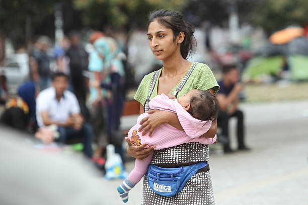 Syrian refugee woman with child in Belgrade stock photo