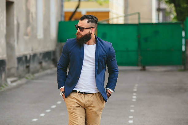 istock Stylish bearded man walks through the city 487715806