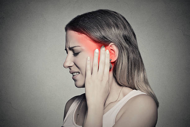 istock side profile sick female having ear pain touching head 487718626