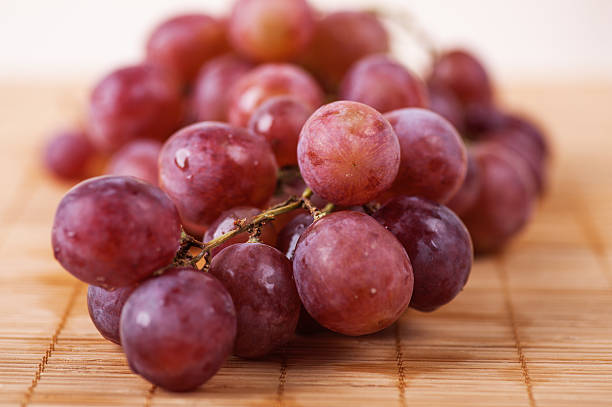 closeup red large bunch grapes stock photo