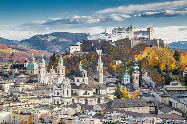 Historic city of Salzburg in fall, Austria Aerial view of the historic city of Salzburg with Hohensalzburg Fortress in beautiful evening light in fall, Salzburger Land, Austria. salzburger land stock pictures, royalty-free photos & images
