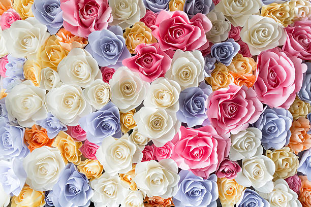 Backdrop of colorful paper roses stock photo