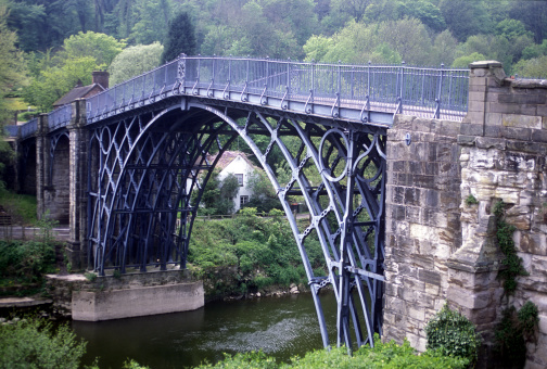 The robust structure of the first single span cast iron bridge built in 1779 lends its name to the town of Ironbridge, Shropshire