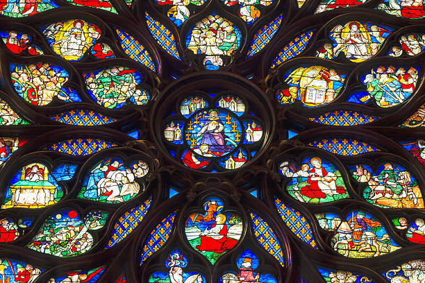 Jesus Sword Rose Window Stained Glass Sainte Chapelle Paris France Paris, France - June 1, 2015: Jesus Christ With Sword Biblical and Medieval Stories Rose Window Stained Glass Saint Chapelle Paris France.  Saint King Louis 9th created Sainte Chappel in 1248 to house Christian relics, including Christ's Crown of Thorns.  Stained Glass created in the 13th Century and shows various biblical stories along wtih stories from 1200s. sainte chapelle stock pictures, royalty-free photos & images