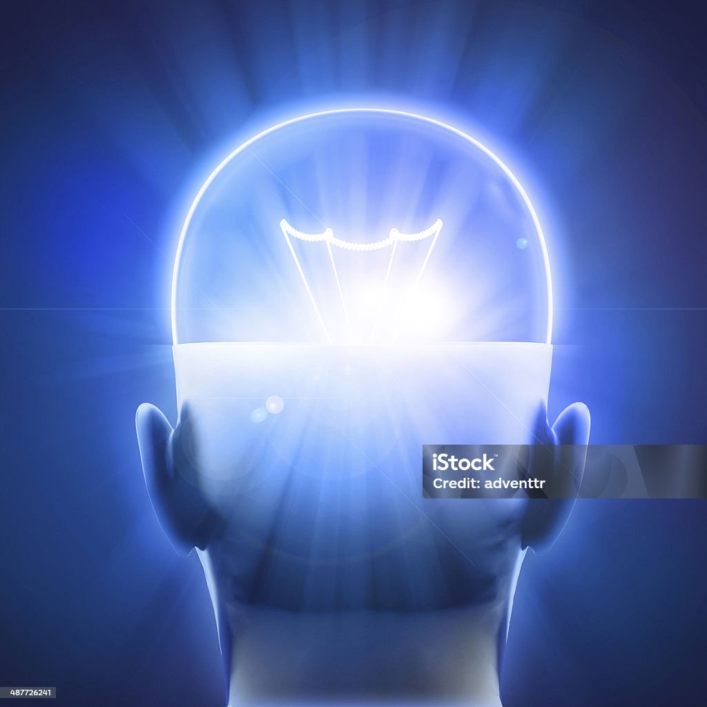 Intelligence Bright bulb shining on the top a of a man's head. Intelligence concept. Lens flare effects added. Human Brain Stock Photo