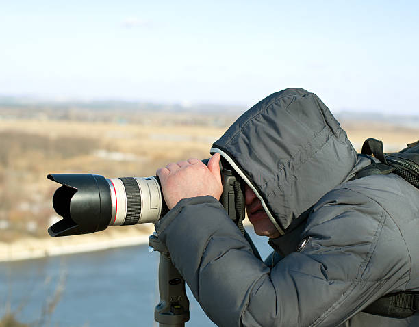 istock Photographer looking through the viewfinder 487726255
