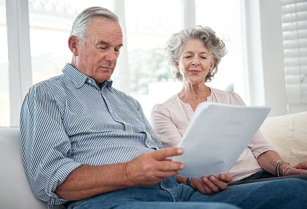 istock Reviewing their insurance policies 487726304