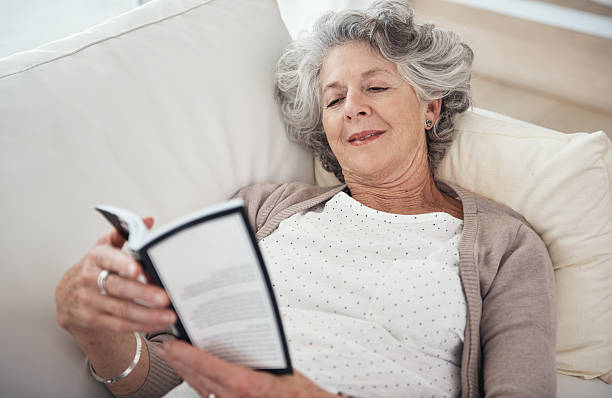 istock Relaxing with an old favorite of hers 487726466