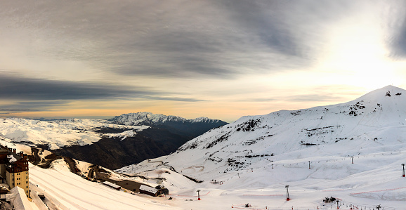 Aerial view of snow mountain range landscape with clouds. Alps mountains, Austria