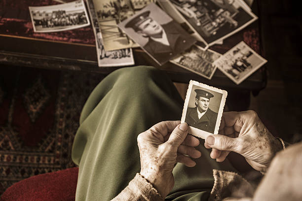 istock Senior woman with dear photographs 487726909