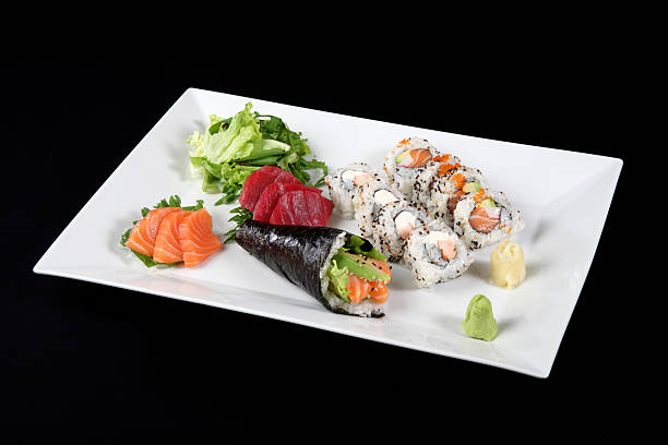 istock sushi sashimi with wasabi and  vegetable in white plate 487727418
