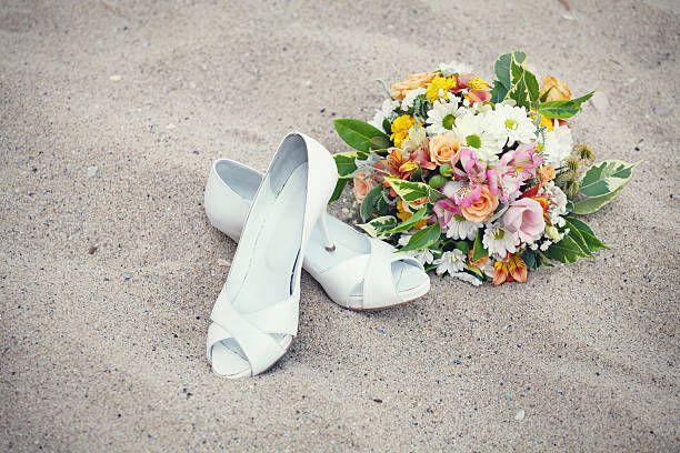 Bridal shoes and wedding bouquet Bridal shoes and wedding bouquet beach wedding shoes stock pictures, royalty-free photos & images