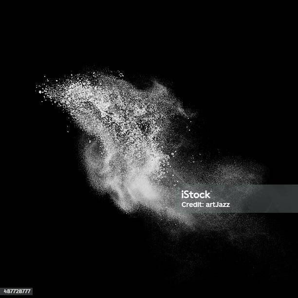 White Powder Explosion Isolated On Black Stock Photo - Download Image Now - Black Background, Spray, White Color