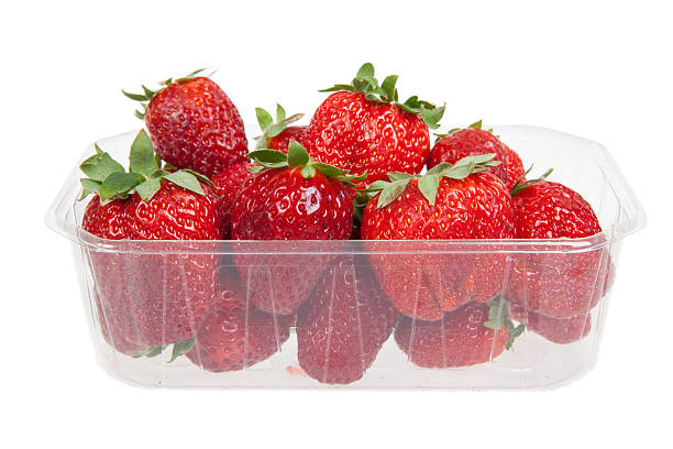 istock Fresh strawberries in plastic box, isolated on white 487728923