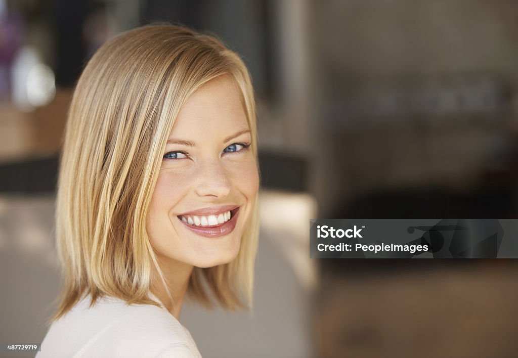 Confidence gives her that special something! A gorgeous young blonde woman looking at the camera Women Stock Photo