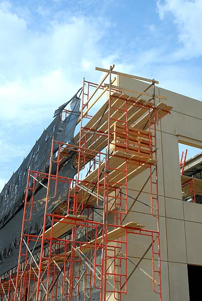 istock Scaffolds rise to assist construction works 487730138