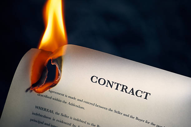 istock Closeup Of Contract In English Burning On Fire 487732308