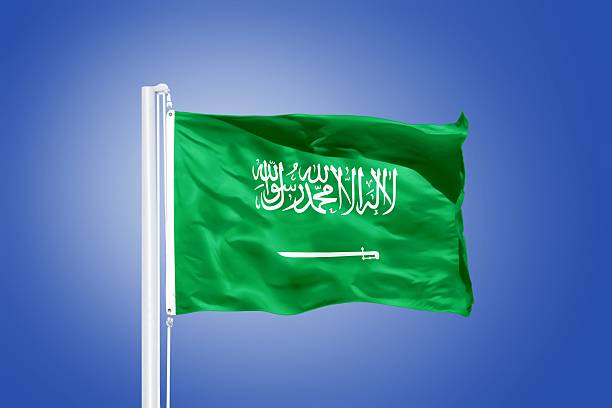 istock Flag of Saudi Arabia flying against a blue sky 487732768