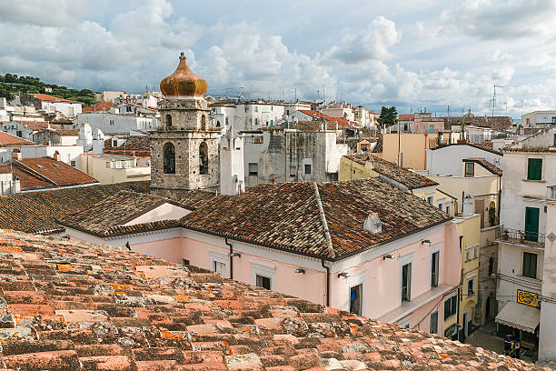 istock Old church tower surrounded by historical houses 487736428