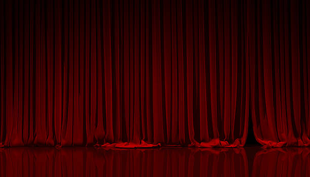 istock Red curtain in theater. 487737236